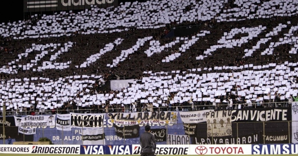 16mai2013---torcida-do-olimpia-faz-mosaico-antes-da-partida-contra-o-tigre-pela-libertadores-1368751593549_956x500.jpg
