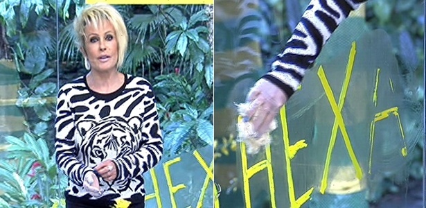 9.jul.2014 - Ana Maria Braga tenta tirar o "hexa" que estava escrito no vidro de seu estúdio 9.jul.2014 - Ana Maria Braga tenta tirar o "hexa" que estava escrito no vidro de seu estúdio