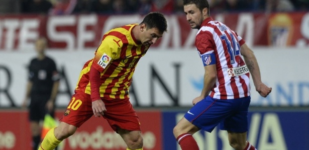 11. jan. 2014 - Lionel Messi tenta passar pela marcação de Gabi em jogo do Barcelona contra o Atlético de Madri, pelo Campeonato Espanhol